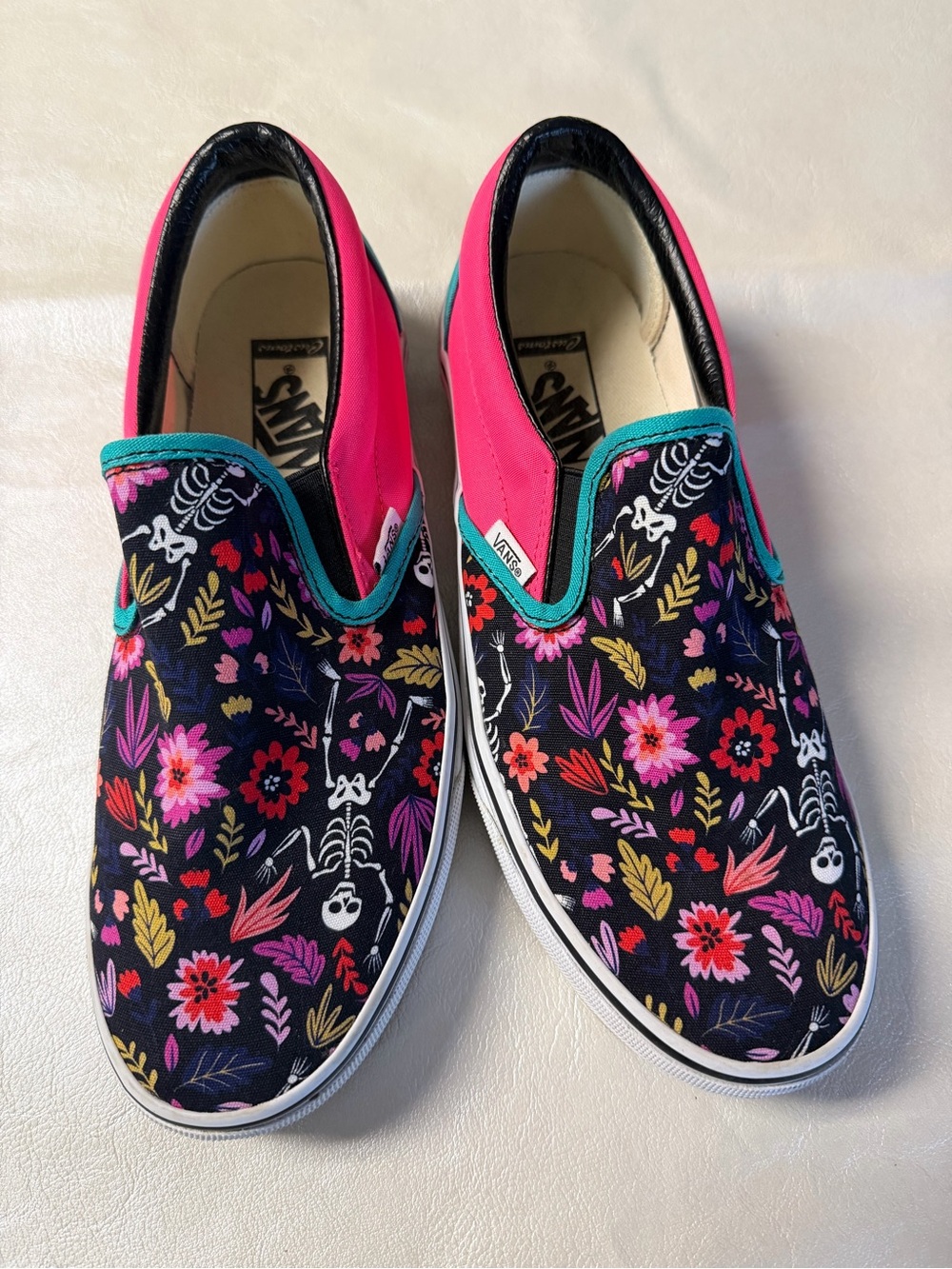 Vans Women Slip-On Floral Skeleton Print Sneakers - Pink/Black